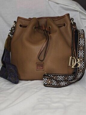 Dooney and Bourke Drawstring Bucket Bag With Gold DB Metal Letters Charm
